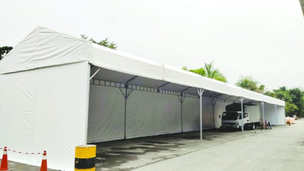 Long marquee tent supplied by a canopy tent manufacturer in Malaysia for events and industrial shelter.